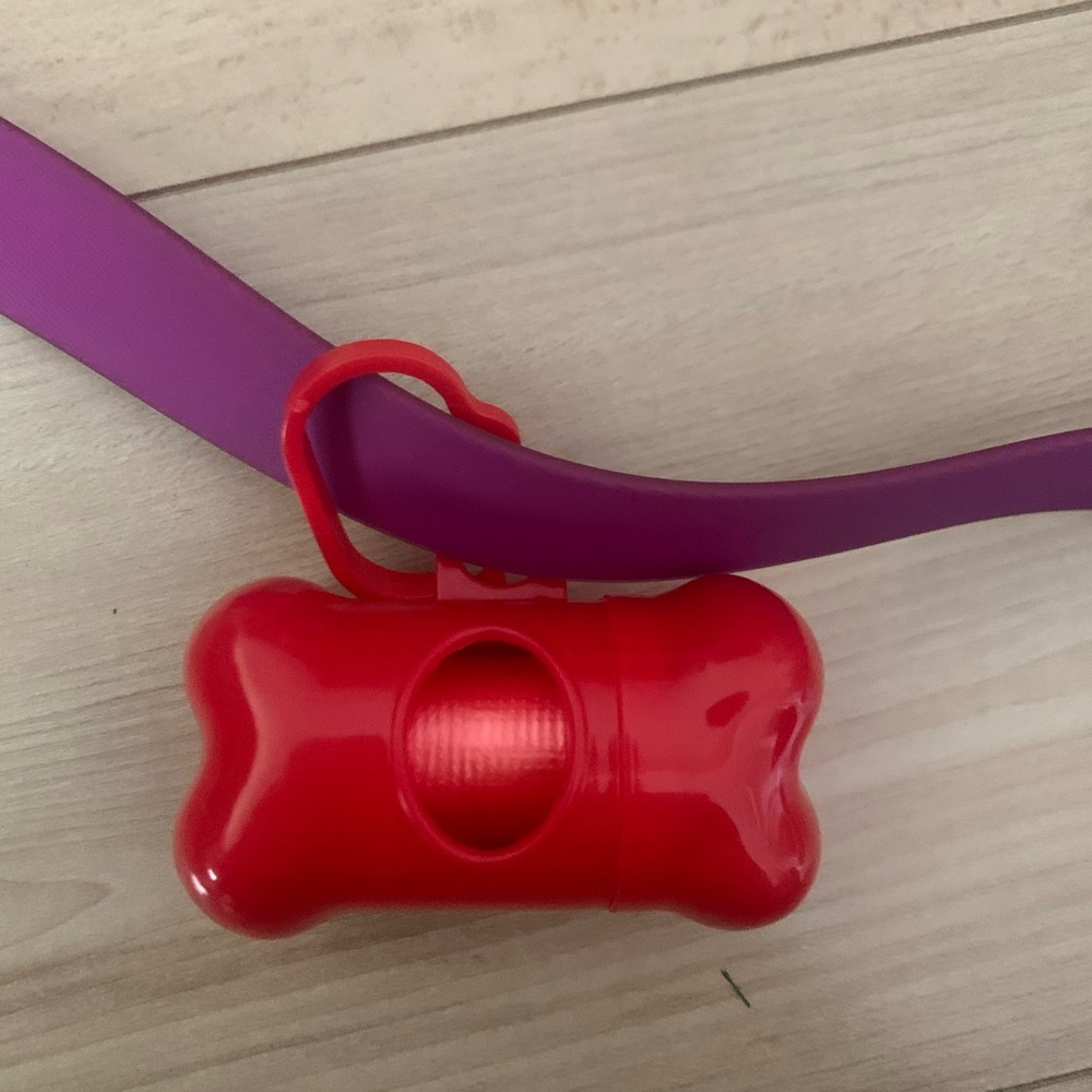 Red doggie poo bag holder
